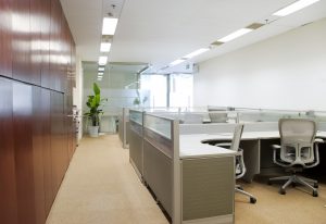 A modern office with gray office desks